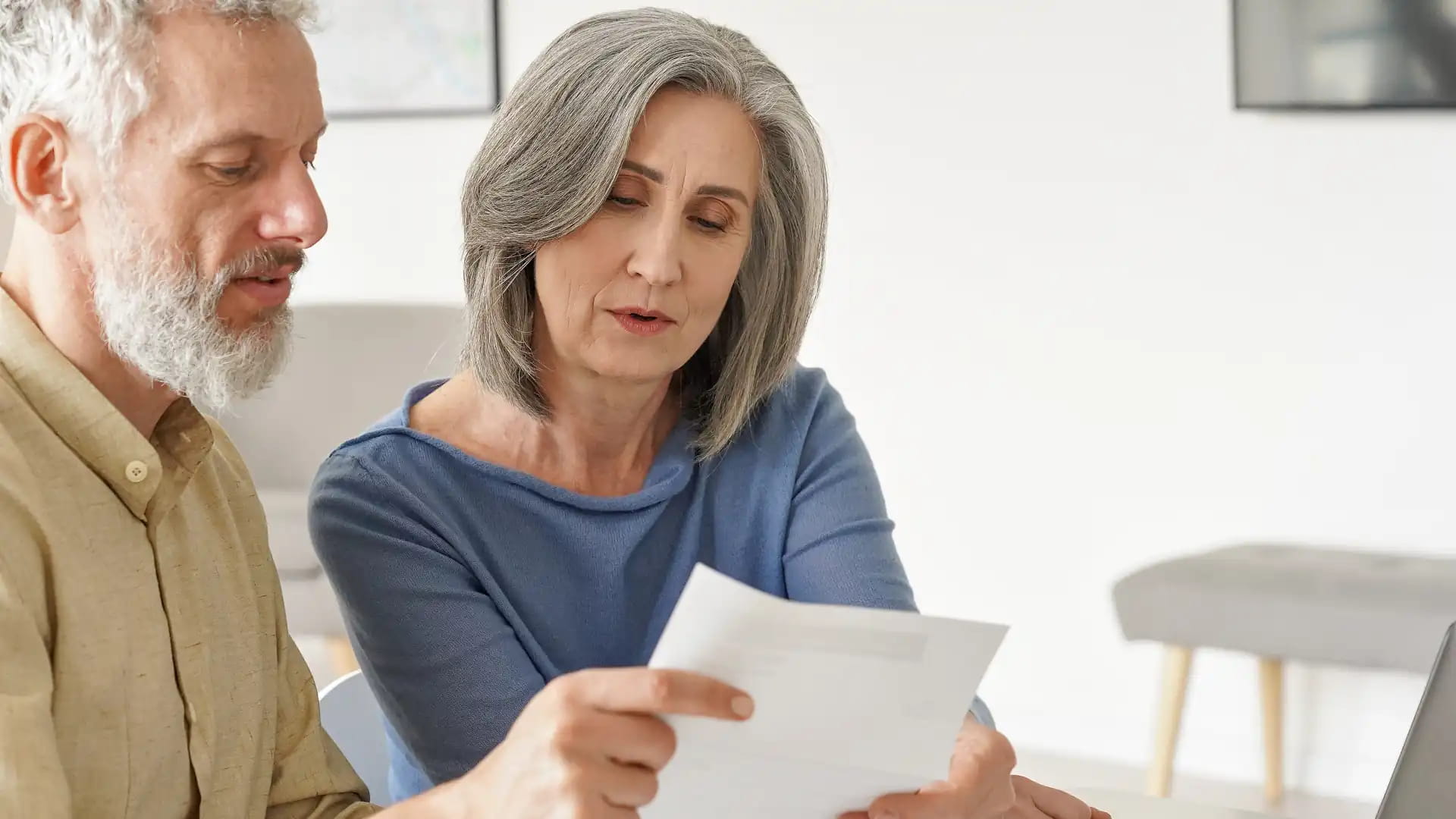 Separating couple looking over trust paperwork – trusts NZ