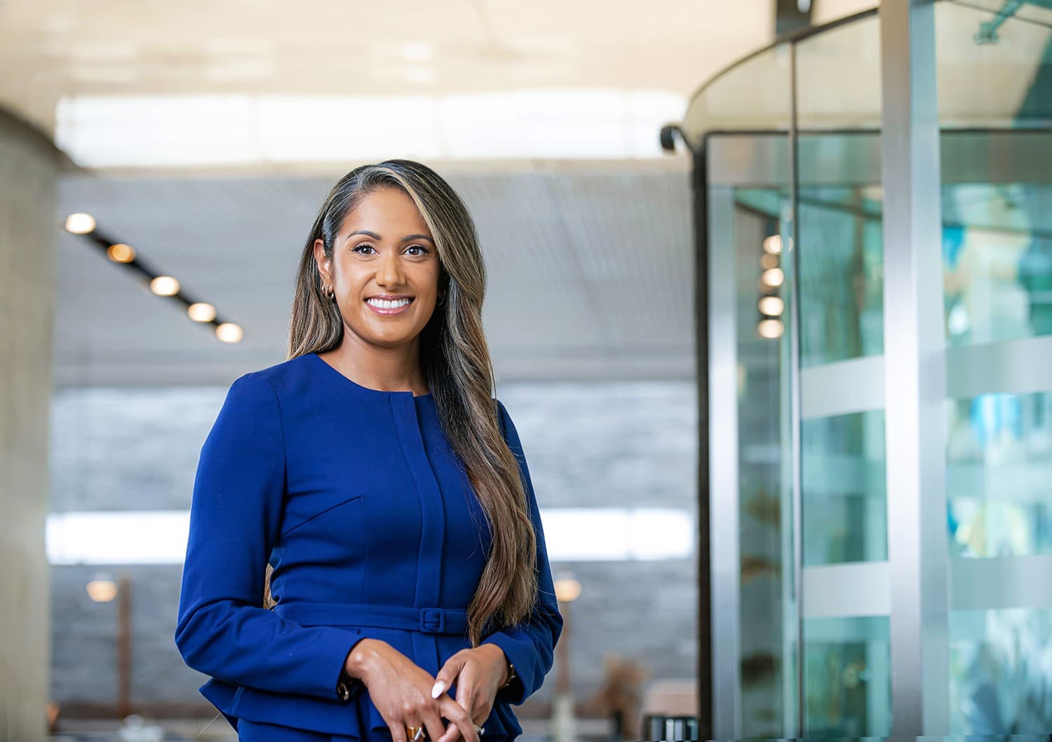 SC Profile Page Photo of Sharon Chandra wearing a blue business suit