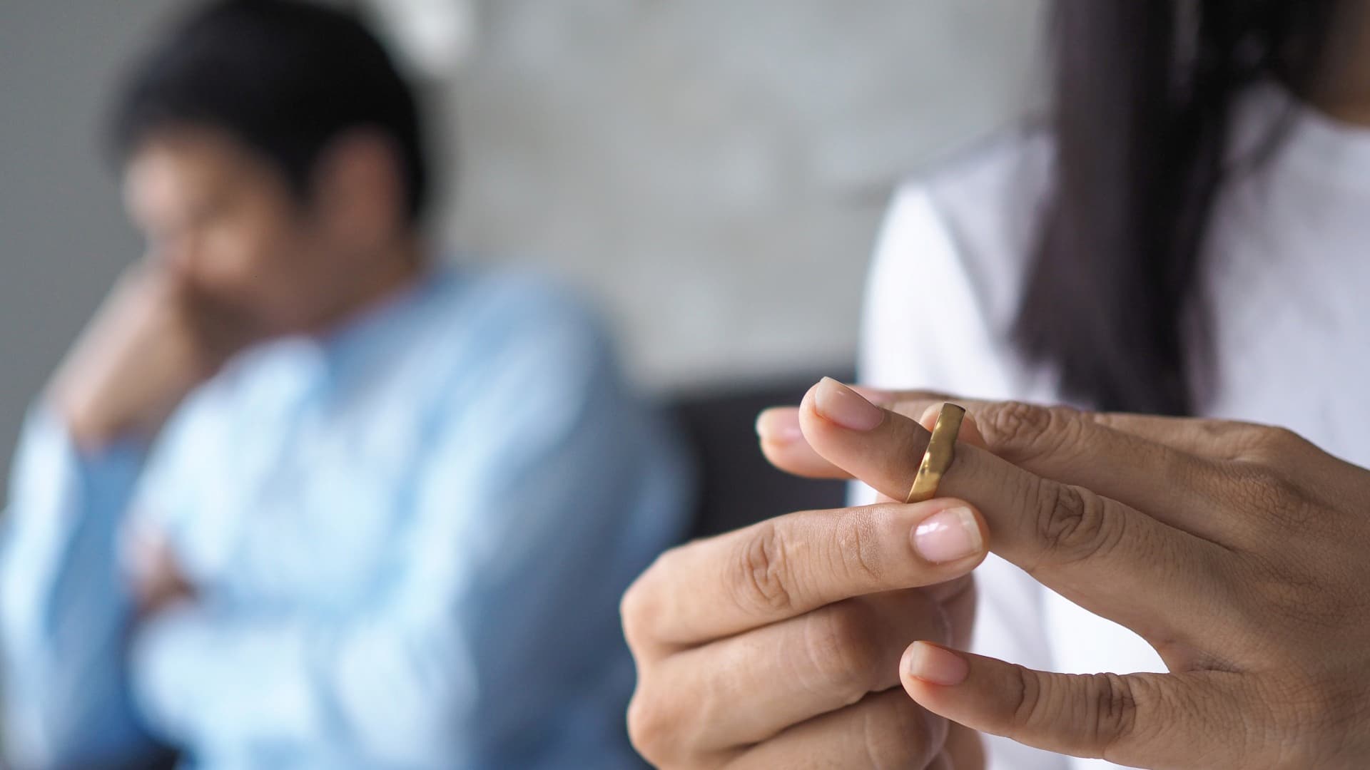 Separation vs Divorce – Person Removing Wedding Ring