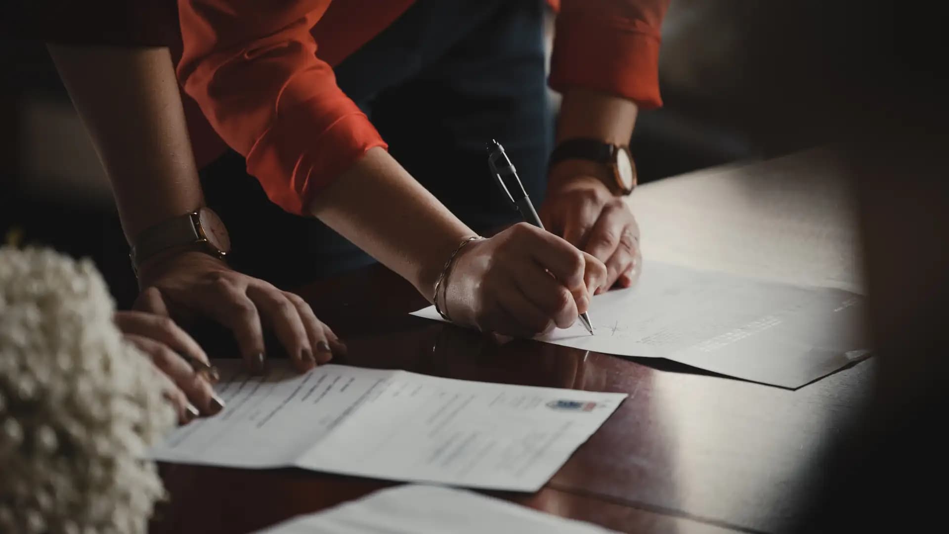 Lawyer and their client going through documents regarding their reasons to contest a will.